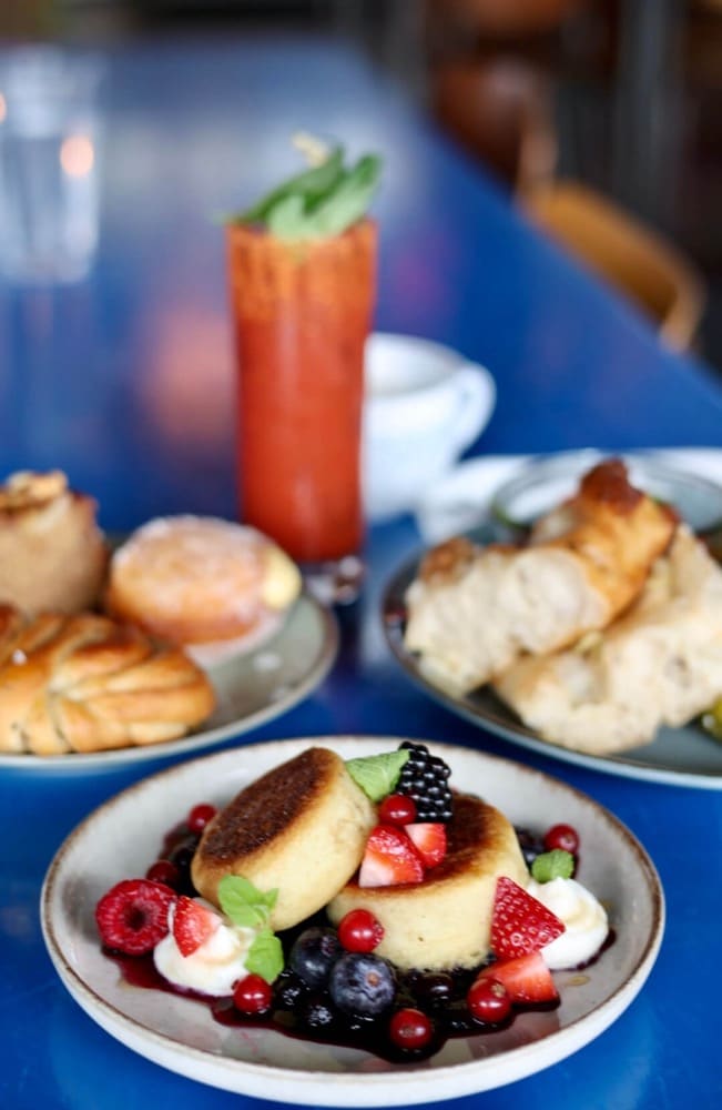 Pancakes with berries and a Bloody Mary