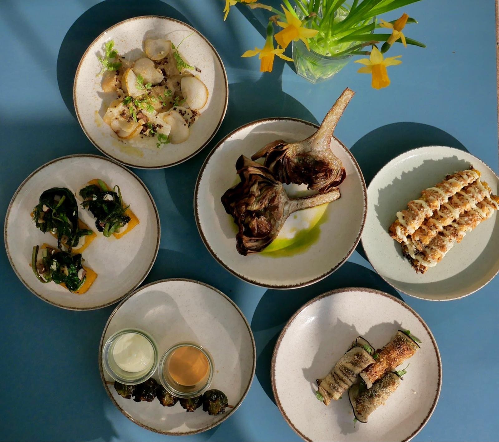 Antipasti plates on a blue table